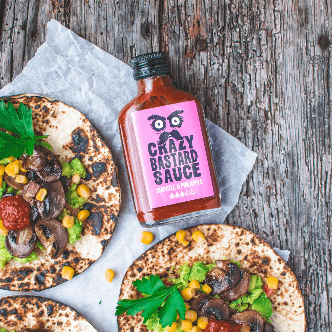 Smoky chipotle and sweet pineapple hot chilli sauce, handcrafted in the UK, perfect for BBQs, marinades, and tacos.