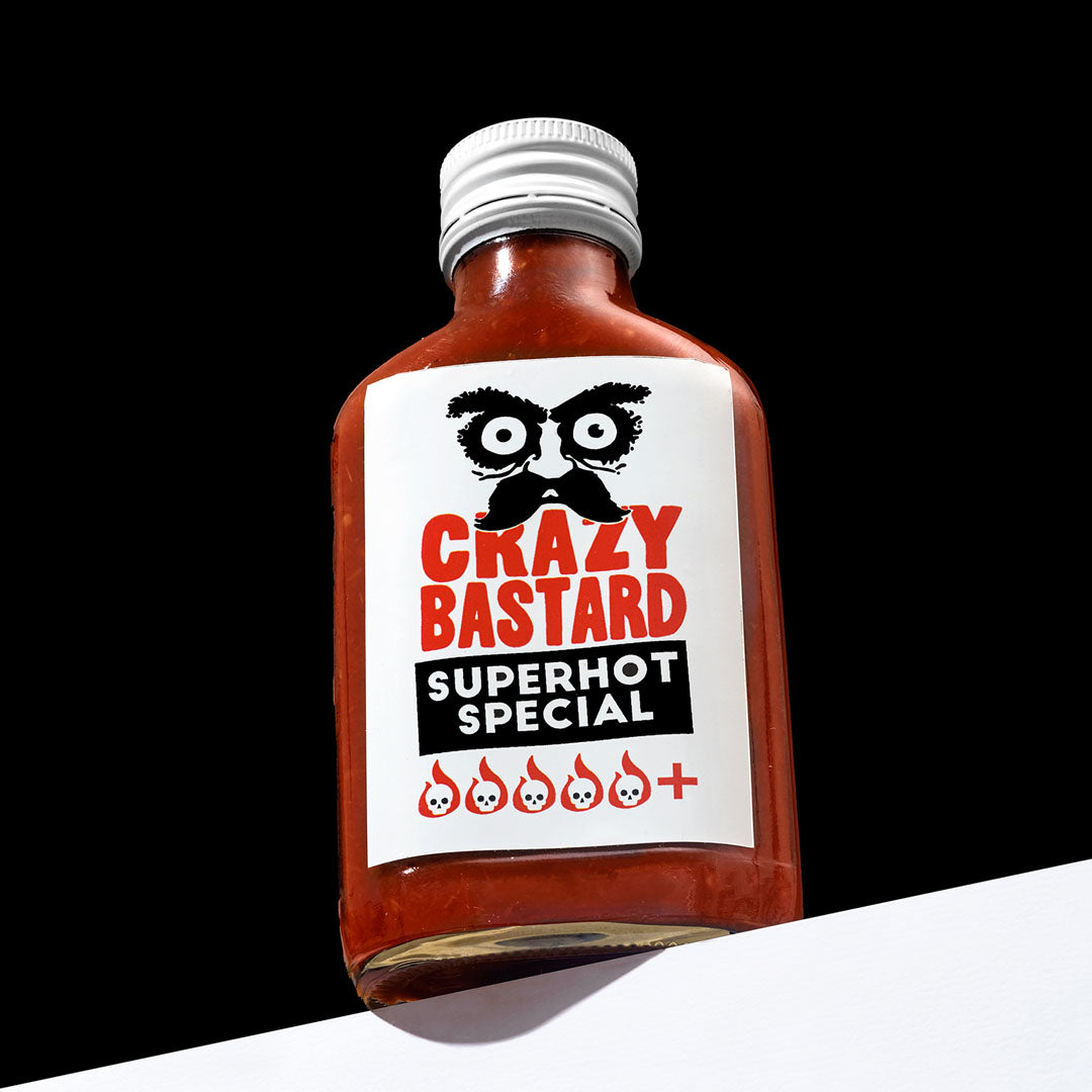 Super hot  fermented chilli sauce, handcrafted in the UK, ideal for adding explosive heat and flavor to marinades, wings, and spicy dishes.