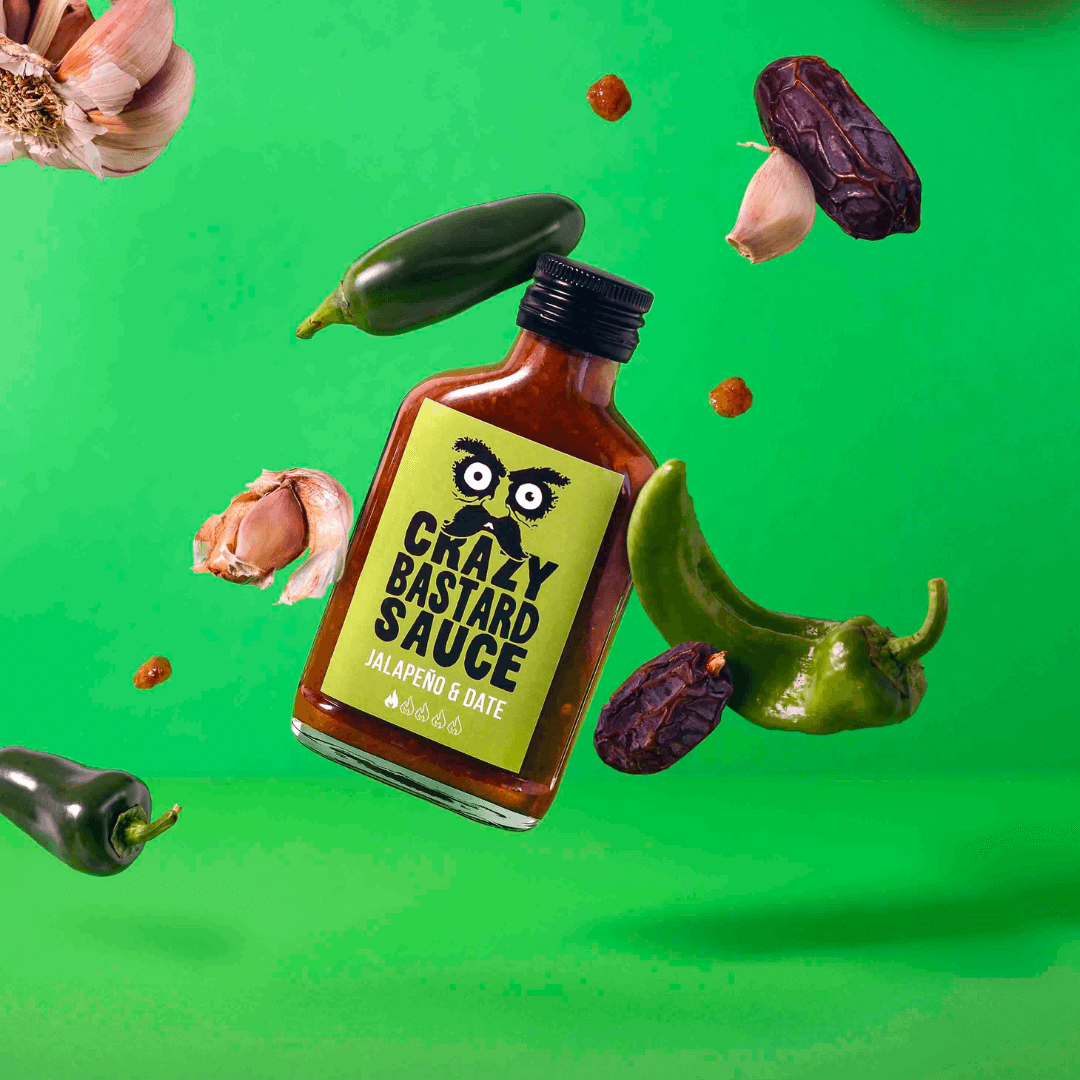 Hot Sauce Bottle on a green background